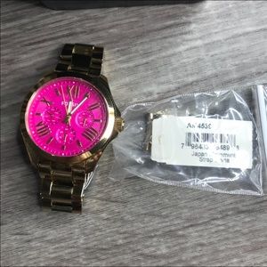 Fossil watch pink and gold.